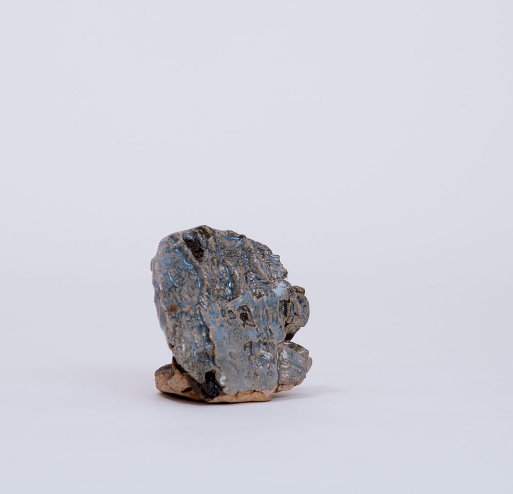 PAUL WACKERS -  Pressed WoodstockStoneware and glaze on stoneware2.5 x 2.5 x 2.5”